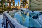 Private hot tub with new deck and built in log bench seating